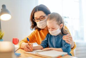 Girl with teacher in classroom
