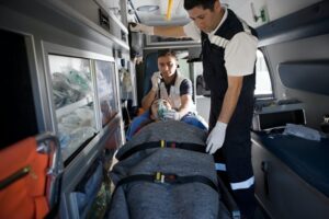 Ambulance staff and patient on stretcher