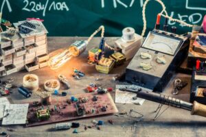 Electronics workshop in physics lab on old wooden table