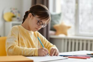 Girl With Down Syndrome Drawing Pictures