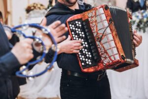 musicians playing on accordion and tambourie