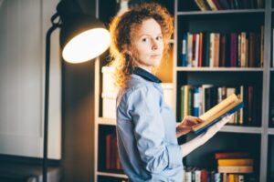 Portrait of beautiful blond woman with notebook
