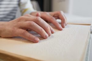 Woman Reading Braille Close Up