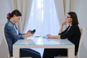 Female social worker talking to a teenage girl