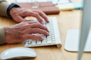 Software engineer typing on keyboard