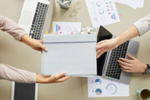Handing Folder to Colleague