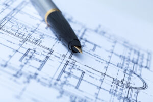 Pen and architectural blueprints