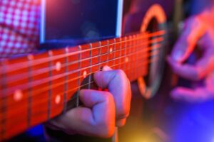 young male musician with a guitar