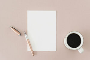 Blank note and a cup coffee