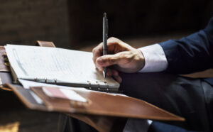Businessman writing a note