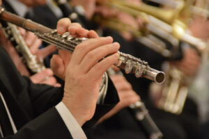 Man’s hands playing flute