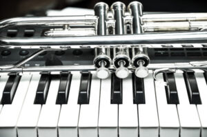 Trumpet on keyboard background