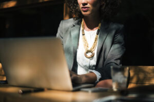Woman working with laptop at coffee shop