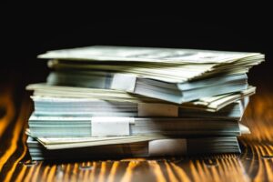 Big pile of money dollars, Pile with American one hundred dollar bills, Bank employees sorting