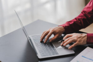 Close-up of printing data check data on laptop