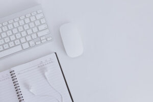 White office desk with note book