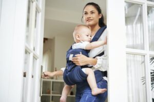 Young mother leaving house