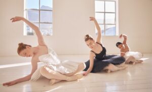 Ballet team training, exercise and dance in theater, studio or stage for competition, production or