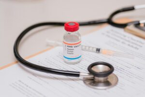 Measles mumps and rubella vaccine vial doctors counter