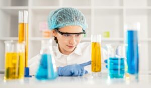 Girl doing chemical experiment during lesson
