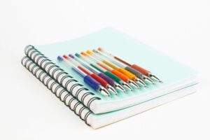notebooks and pens