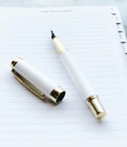 Planner and a pen - Blank notepad - Paper and pen