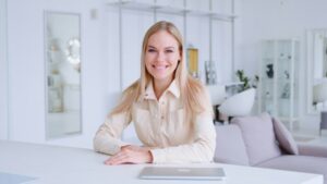 Smiling attractive adult woman with a blong hair looking at camera