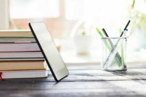 books and pc tablet on the table. study and prepare for exam. modern education concept.