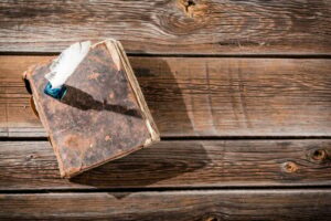 Old book and a fountain pen with ink